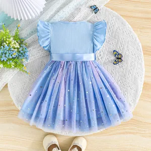 Detailed view of the star and moon sequin mesh skirt on this blue princess dress