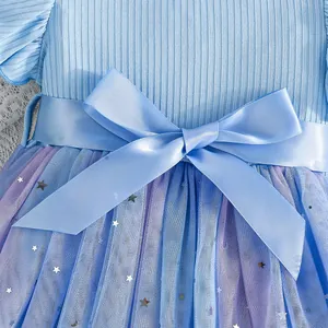 Detail view of blue girl's princess dress with satin bow and star sequin tulle mesh