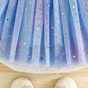 Detail of blue gradient tulle skirt with silver star and moon sequins for girls dress