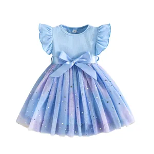 Detail of blue girl's princess dress featuring star and moon sequin mesh skirt