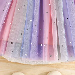 Detail of rainbow tulle skirt with silver star and moon sequins for princess dress