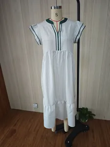 Detailed studio view of a striped V-neck dress with contrast green trim on a mannequin