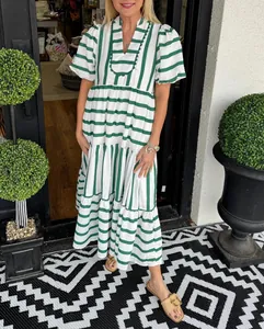 Fashionable green and white striped tiered maxi dress with puff sleeves for summer
