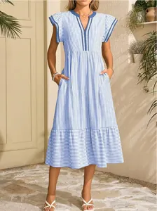 Detail view of blue striped V-neck dress featuring ruffled short sleeves and pockets.