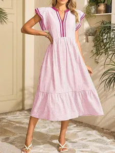 Detail view of pink vertical striped dress featuring ruffle sleeves and contrasting V-neck trim