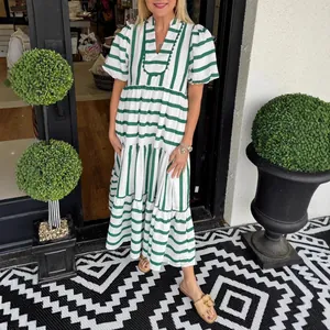 Green and white striped tiered maxi dress with short puff sleeves for summer fashion