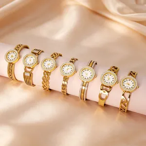 Elegant gold stainless steel bangle watches with assorted镂空 designs for women.