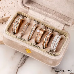 Detailed view of 6-piece rose gold stainless steel ring set with crystal accents