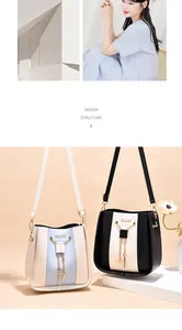 Dual-colored bucket bags in black and white shown with a lifestyle model view.