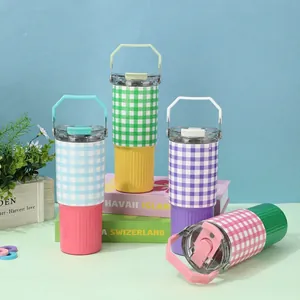 Group of 30oz insulated checkered tumblers with handles and colorful silicone sleeves