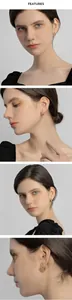 Close-up of elegant gold hoop earrings worn by a model in a lifestyle setting.