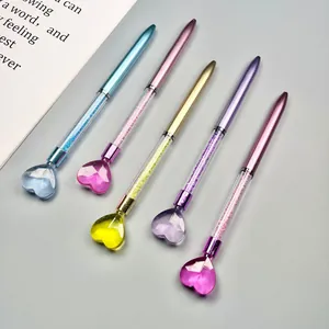 Set of five colorful plastic ballpoint pens with heart-shaped tops and crystal-filled barrels