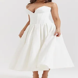 Elegant white strapless corset dress with pleated A-line skirt and cinched waistline