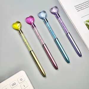 Set of four colorful heart top ballpoint pens filled with sparkling crystals