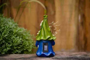 Back view of garden gnome statue with built-in solar panel and power switch