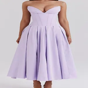 Elegant detail of lilac strapless A-line dress featuring corset bodice and pleated skirt design