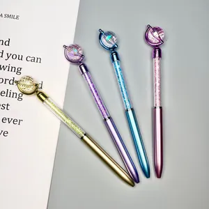 Detail view of crystal planet ballpoint pens with glitter sand