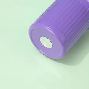 High-quality bottom detail of purple 30oz insulated tumbler with ribbed texture