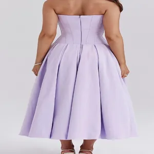 Detailed back view of a lavender strapless corset dress featuring a pleated A-line skirt.