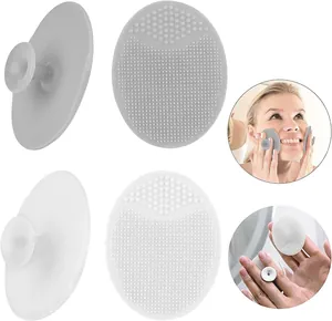 Close-up of soft silicone baby shampoo brush and facial cleanser with suction handle