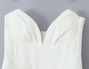 Detailed close-up view of white pleated corset bodice with a sweetheart neckline