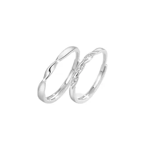 Sterling silver Mobius couple rings set with sparkling cubic zirconia stones