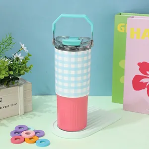 Detailed shot of a 30oz blue gingham and pink stainless steel insulated water tumbler