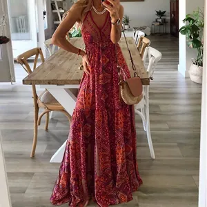 Detailed view of a vibrant bohemian floral maxi dress with ethnic print and V-neckline.