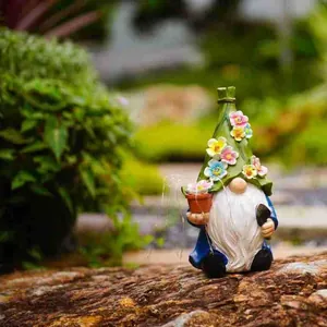 Detailed view of a solar garden gnome ornament with flower hat in outdoor setting