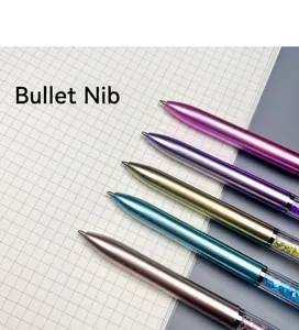 Close-up of metallic ballpoint pens with crystal filled barrels and bullet tips