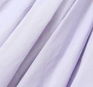 Detailed macro view of light purple pleated fabric showing high-quality twill texture
