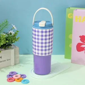 30oz stainless steel insulated tumbler with purple checkered pattern and carry handle