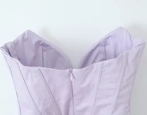 Close-up of lavender corset dress back featuring hidden zipper and pleated boning details