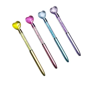 Set of four colorful heart-topped ballpoint pens with crystal barrel accents and metallic finish