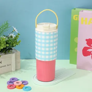 30oz insulated tumbler with blue gingham and pink contrast design and handle