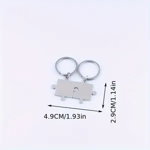 Close-up detail showing exact dimensions of stainless steel puzzle couple keychains