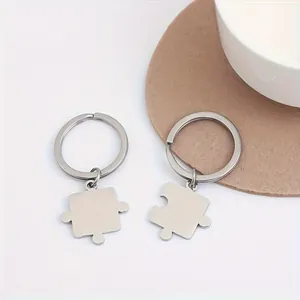 Pair of polished silver stainless steel puzzle piece keychains for couples gift set