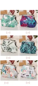 Showcase of tropical palm leaf print coin purses with metal kiss lock closure in six patterns