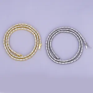 Detailed view of 2mm gold and silver tennis necklaces featuring sparkling cubic zirconia stones