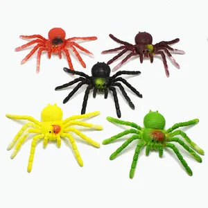 Detailed shot of five colorful soft rubber spiders for pranks and Halloween parties