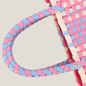 Colorful handmade woven plastic picnic bag featuring sweet pink and blue contrast patterns