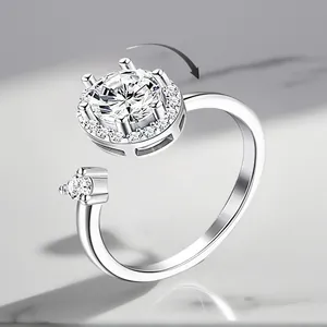 Close-up of rotating silver-plated ring with shimmering zirconia stones for women.