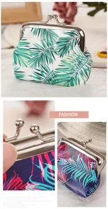 Detailed view of palm leaf tropical rainforest print clasp coin purse texture.