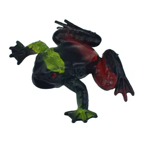 Detailed view of a realistic black and red soft rubber prank frog toy for kids