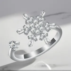 Macro view of a luxury adjustable silver-plated ring with a snowflake zircon design.