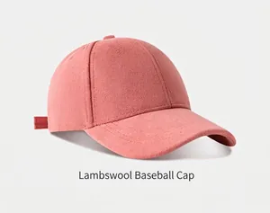 Detailed close-up of a pink suede baseball cap showing soft texture and fine stitching.