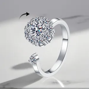 Detailed macro of a rotating silver fidget ring with sparkling zirconia stones.