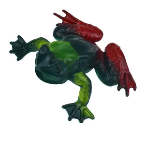 Close-up detailed view of a realistic soft rubber frog toy with black, green, and red colors