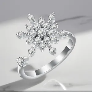 Detailed view of silver-plated rotating ring featuring a large sparkling zirconia snowflake motif