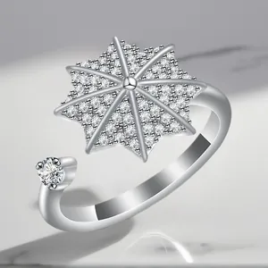 Elegant silver plated spinning ring with a sparkling snowflake star zircon inlay